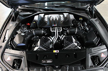 View of engine in preowned BMW dealer Belmont CA