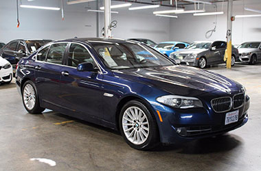 Palo Alto used car dealer offering a blue BMW for sale.